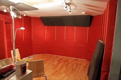 Red fabric covering the Rockwool acoustic treatment