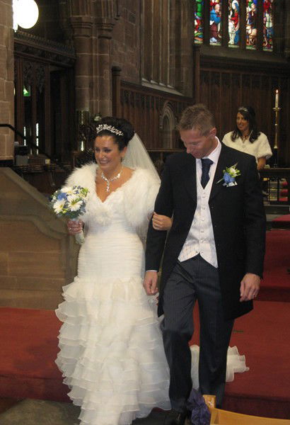 Bride and groom leaving alter
