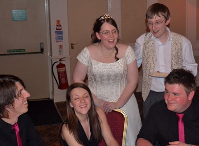 Bride and groom with band