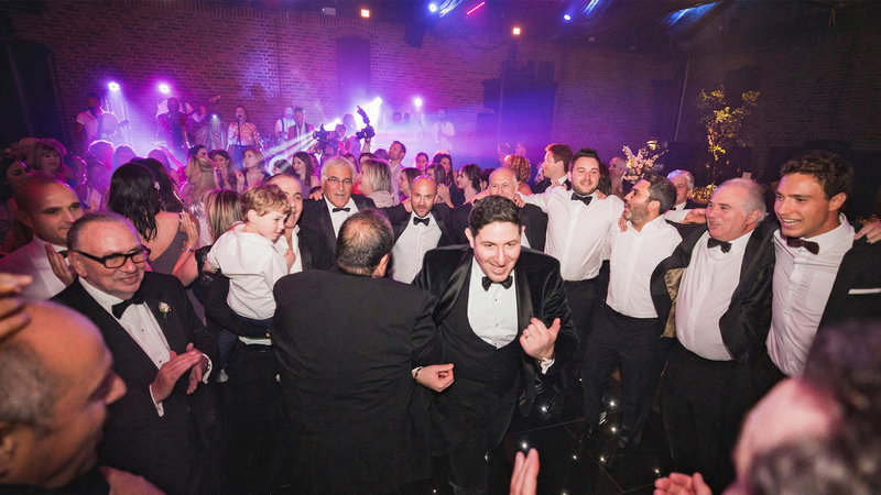 Great wedding band performing to a packed dancefloor at a wedding reception