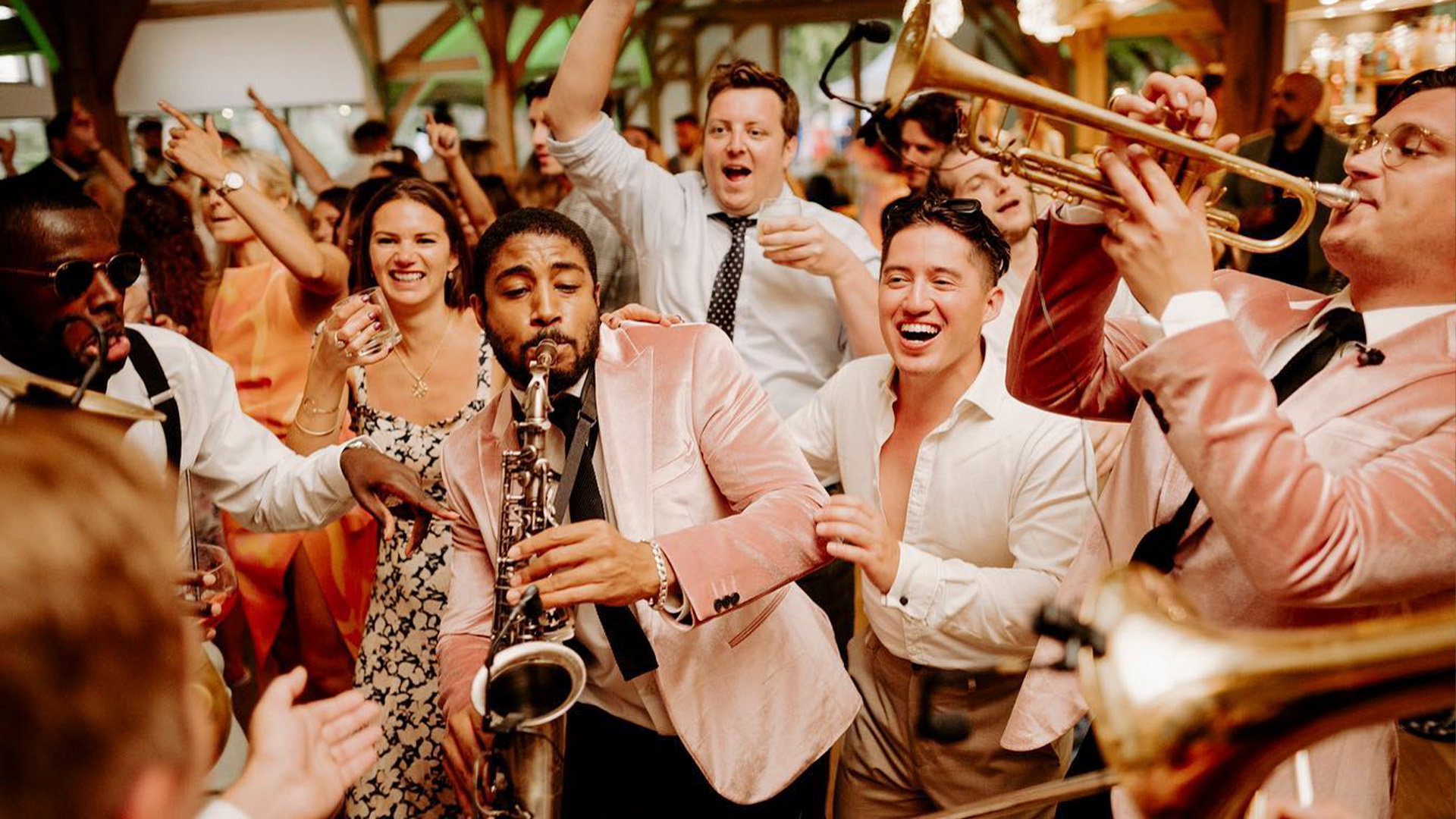 Live wedding band performing during an evening wedding reception