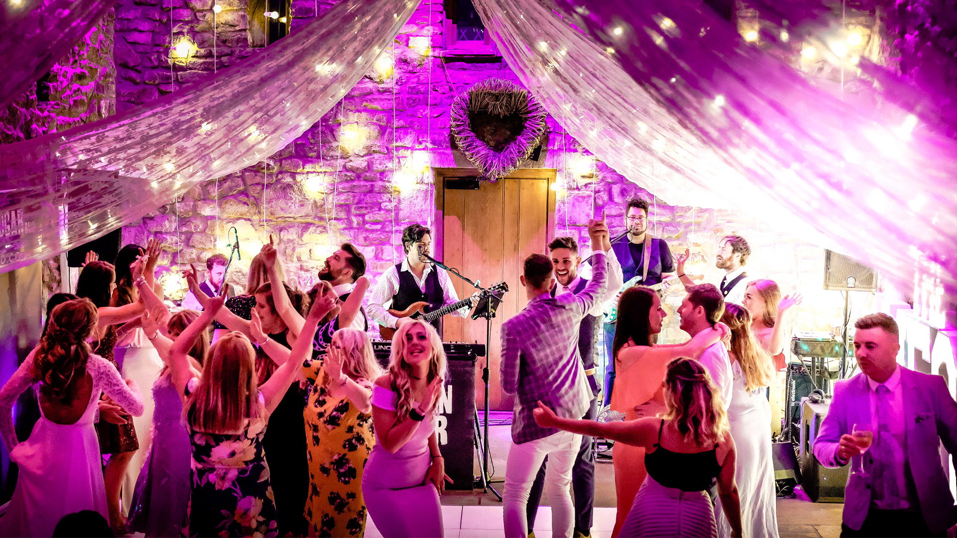 Professional wedding band performing with PAT-tested equipment at a UK wedding venue